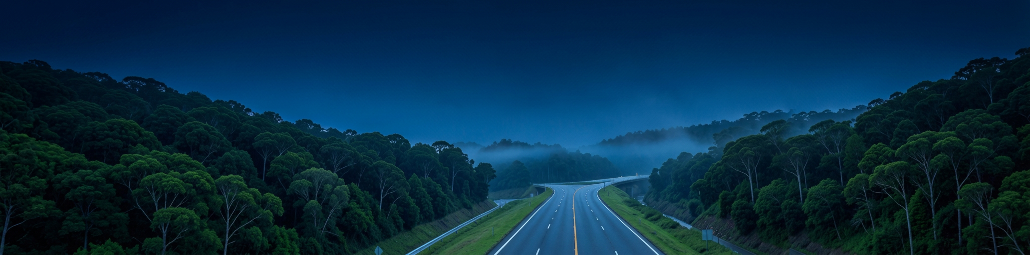 A quiet Virginia highway curving through forested hills